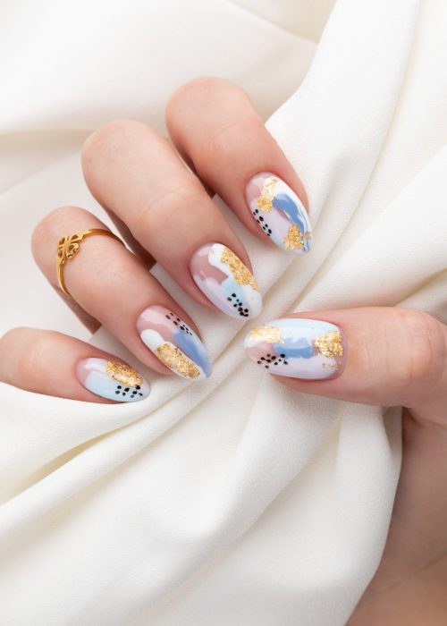 woman-s-hand-with-fashionable-nails-holding-fabric woman-s-hand-with-fashionable-nails-holding-fabric